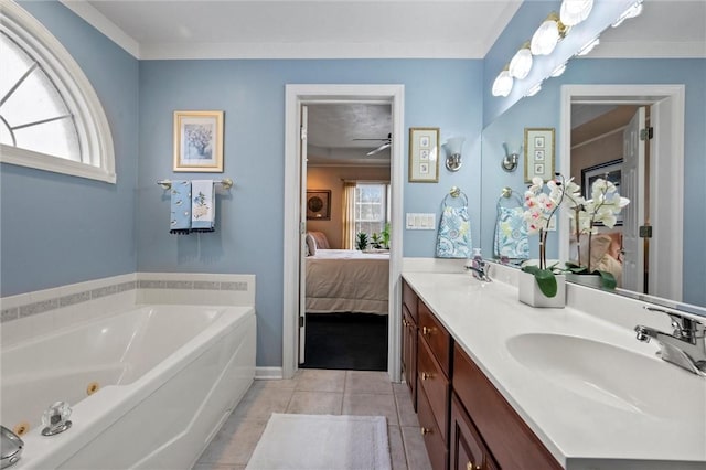 bathroom with a healthy amount of sunlight, crown molding, tile patterned floors, and a bathing tub