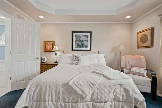 carpeted bedroom with crown molding and a raised ceiling