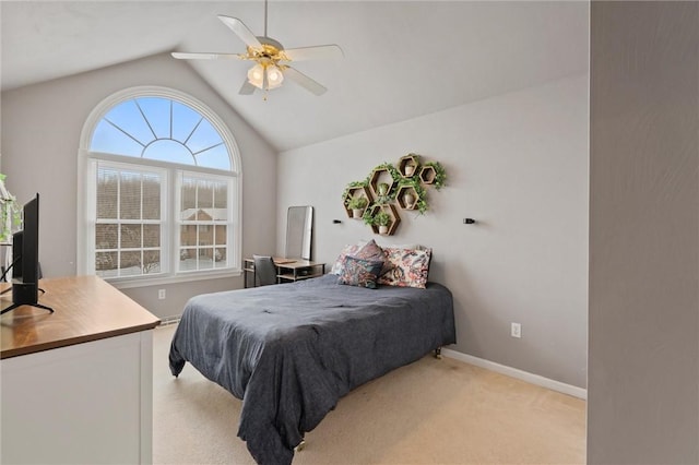 carpeted bedroom featuring ceiling fan and lofted ceiling