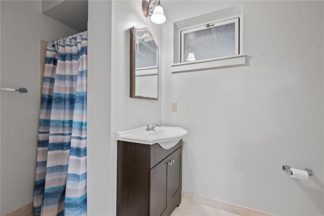 bathroom featuring vanity, a shower with curtain, and tile patterned flooring