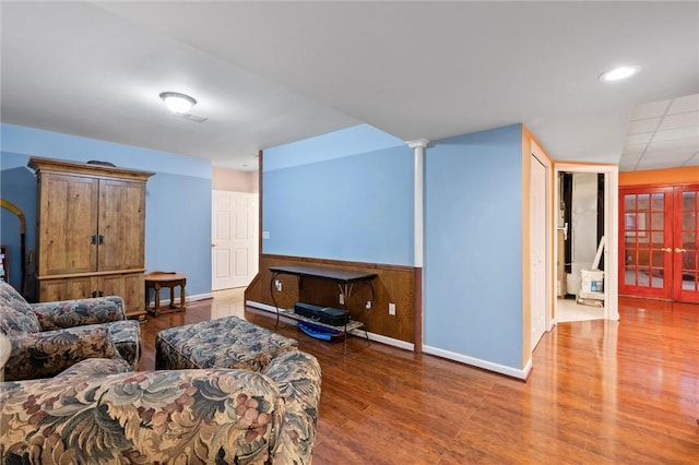 living room with wood-type flooring and french doors