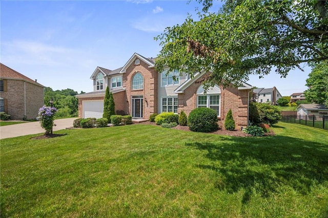 1004 Deveron Ct, Jeannette, PA 15644 - traditional-style home with concrete driveway, brick siding, and a garage