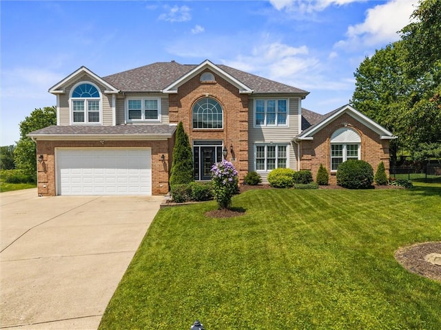 1004 Deveron Ct, Jeannette, PA 15644 - view of front facade with driveway, brick siding, a front yard, an attached garage, and roof with shingles