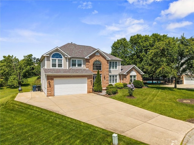 1004 Deveron Ct, Jeannette, PA 15644 - view of front of house with brick siding, concrete driveway, an attached garage, a front yard, and roof with shingles
