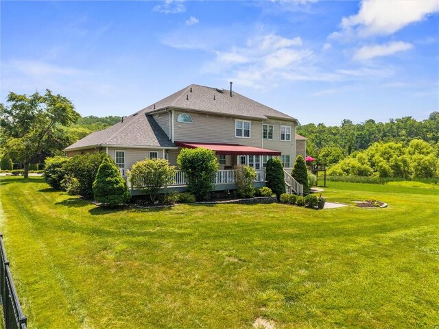 1004 Deveron Ct, Jeannette, PA 15644 - rear view of property with a wooden deck and a lawn