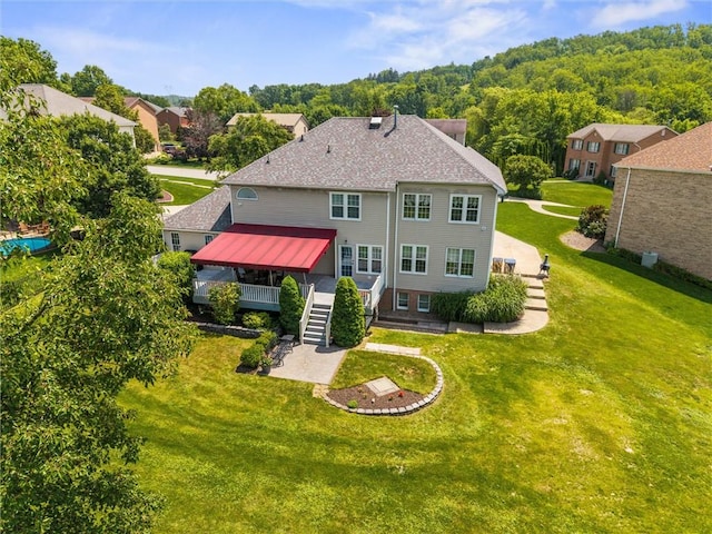 1004 Deveron Ct, Jeannette, PA 15644 - back of house with a deck, stairway, and a lawn