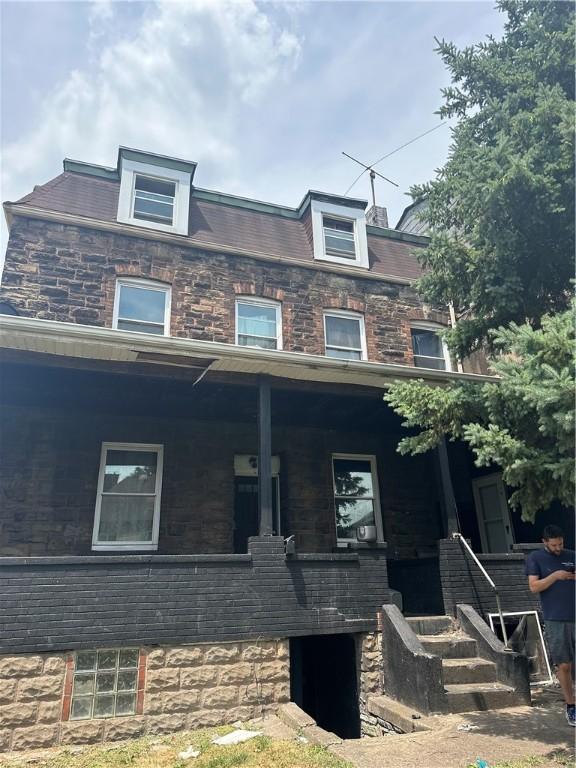 view of property with covered porch