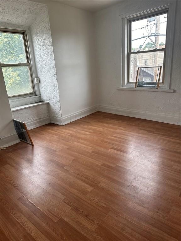 spare room featuring hardwood / wood-style floors