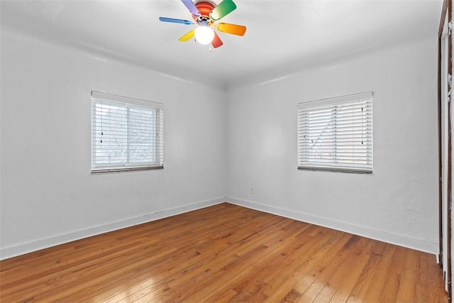 spare room with ceiling fan and light hardwood / wood-style flooring