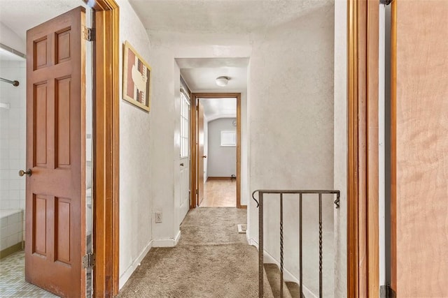 hallway featuring carpet flooring