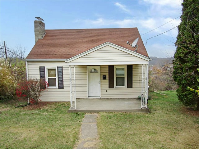 bungalow featuring a porch and a front yard