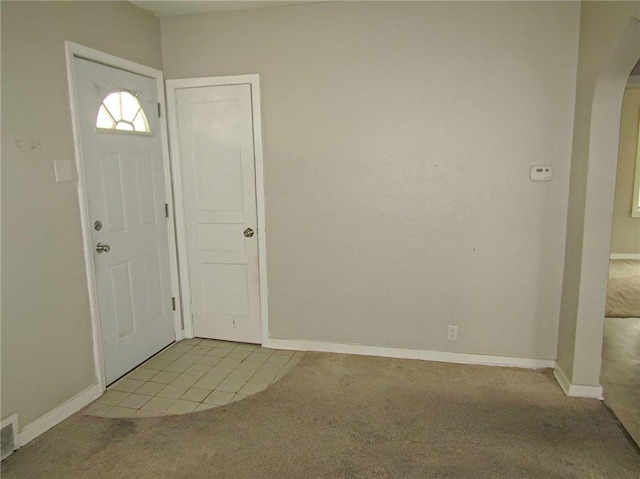 view of carpeted foyer