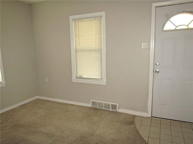 entrance foyer with carpet floors