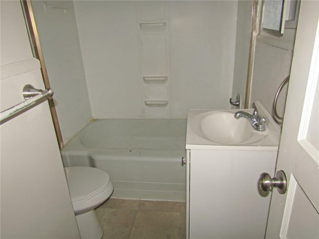 bathroom featuring toilet, vanity, and tile patterned floors