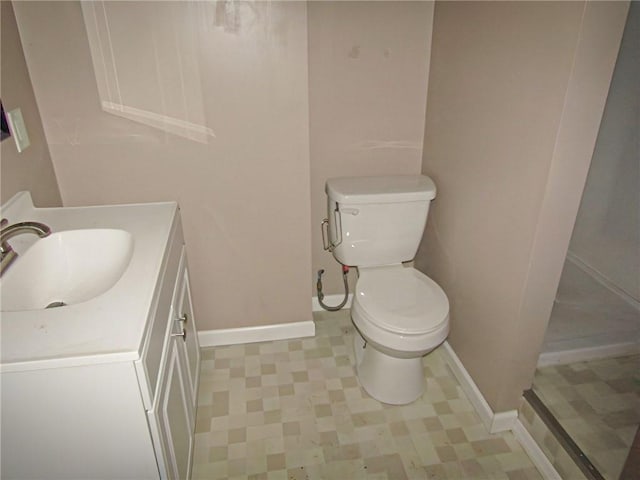 bathroom with toilet and vanity