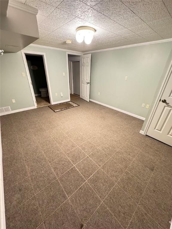 spare room with carpet and crown molding