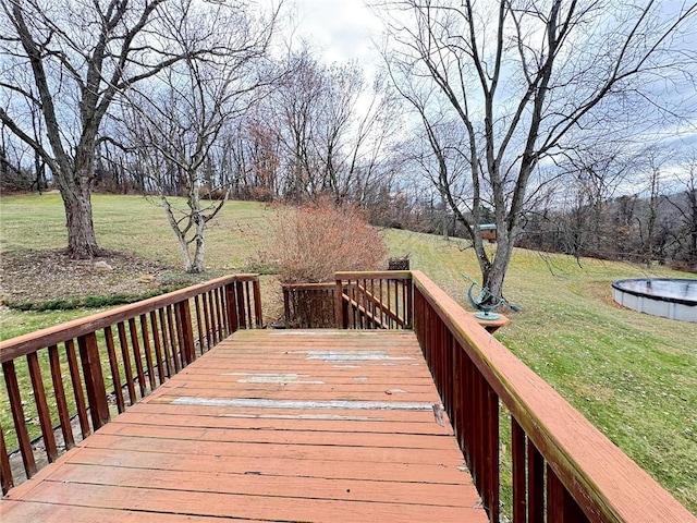 wooden terrace with a yard