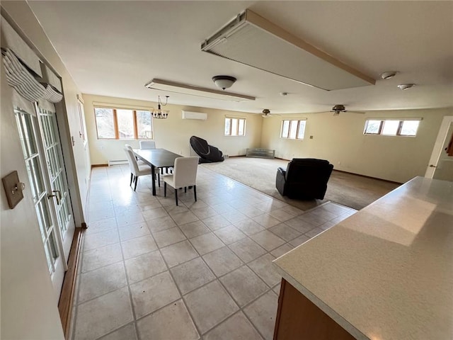 unfurnished dining area with ceiling fan, a wealth of natural light, light tile patterned floors, and a wall mounted air conditioner