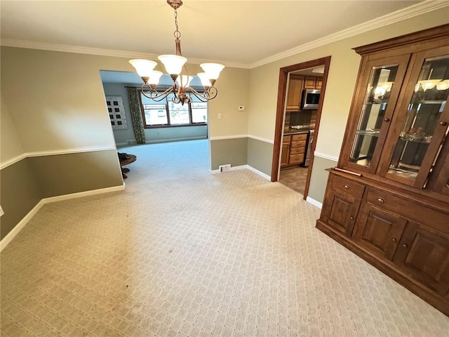 carpeted dining area featuring a chandelier and crown molding