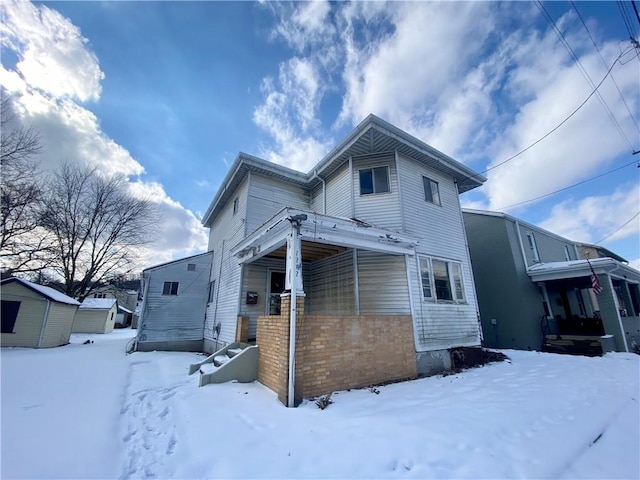 view of snow covered house