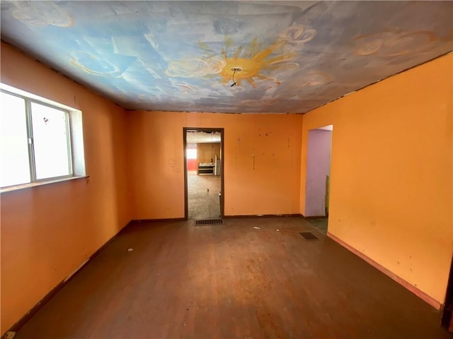 empty room with hardwood / wood-style flooring