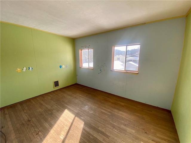 unfurnished room featuring light wood-type flooring