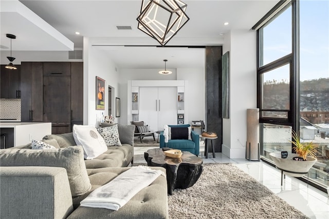 living room featuring a wall of windows