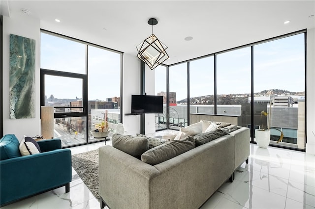 living room featuring floor to ceiling windows and plenty of natural light