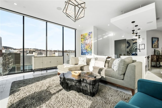 living room featuring floor to ceiling windows