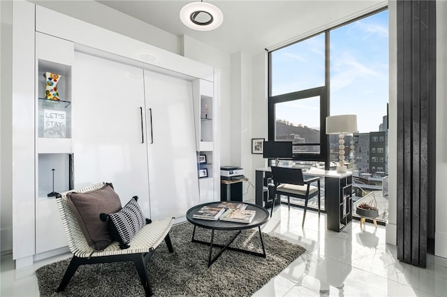 sitting room featuring a wall of windows