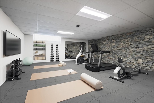 workout room featuring a drop ceiling