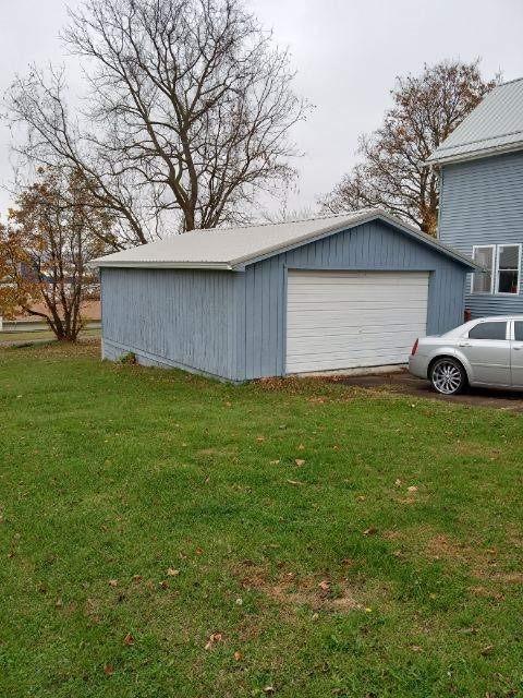 garage featuring a yard