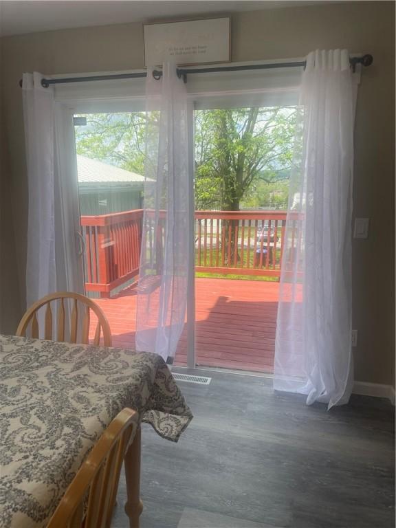 doorway to outside featuring wood finished floors