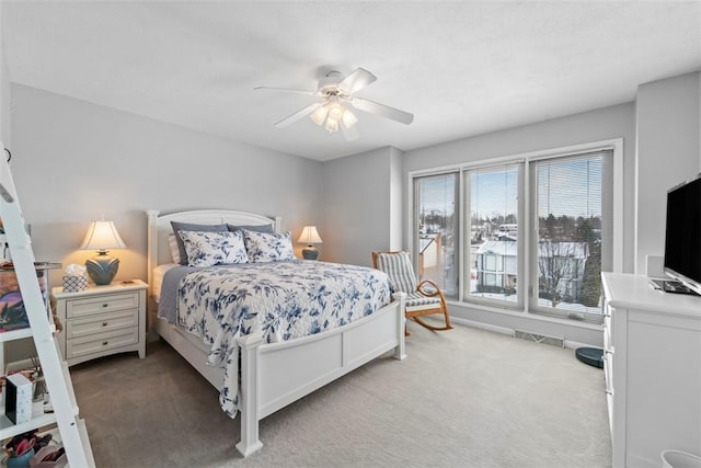 bedroom with ceiling fan and carpet flooring