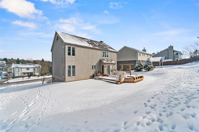 view of snow covered house