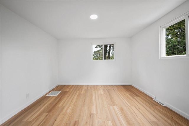 unfurnished room featuring light hardwood / wood-style flooring