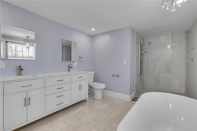 full bathroom featuring toilet, a chandelier, shower with separate bathtub, and vanity