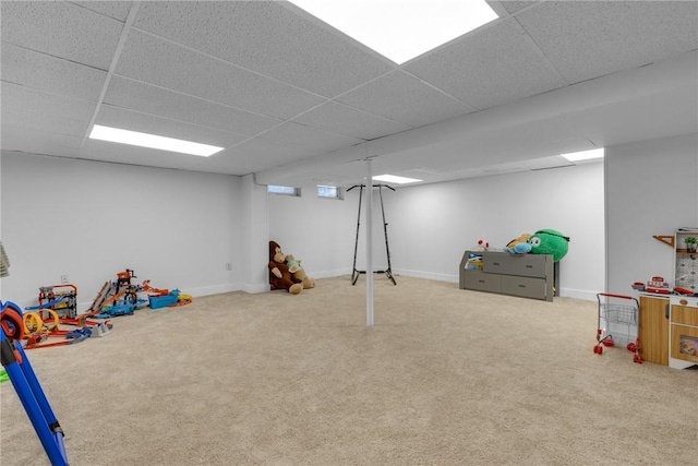 rec room featuring a drop ceiling and carpet flooring