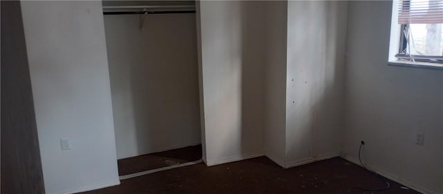 unfurnished bedroom with a closet