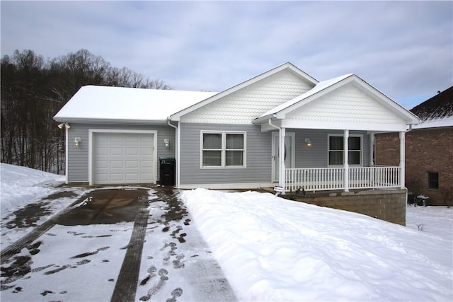 view of front of property featuring a garage and a porch