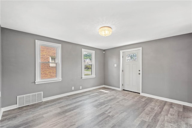 unfurnished room featuring light wood-type flooring