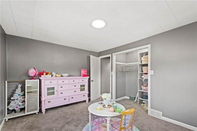 game room with carpet floors, visible vents, and baseboards