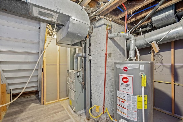 utility room featuring water heater