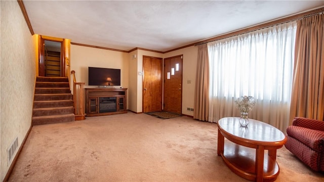 carpeted living room with crown molding