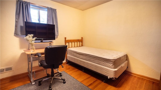 bedroom featuring wood-type flooring