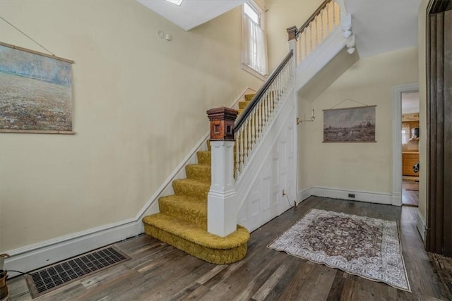 entrance foyer featuring dark hardwood / wood-style flooring