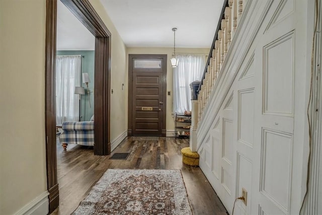 entrance foyer featuring dark hardwood / wood-style floors