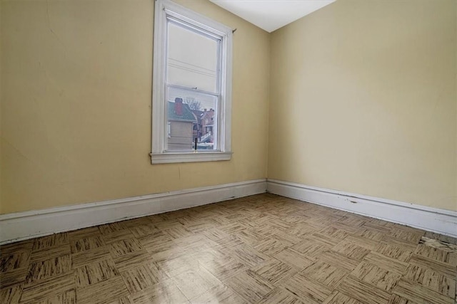 empty room with light parquet flooring