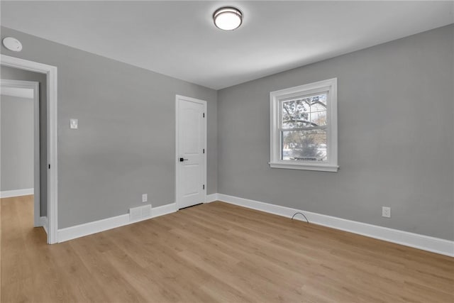 unfurnished room featuring light hardwood / wood-style floors