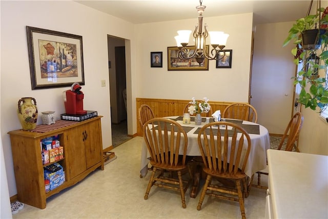 dining area with an inviting chandelier